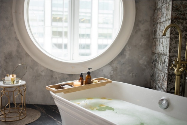 A bathtub with a window view