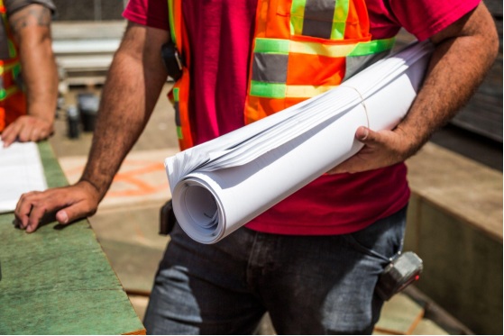A contractor holding draft paper