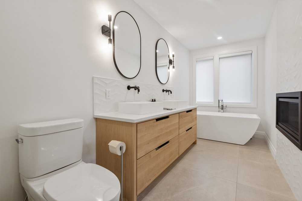 A white-themed bathroom with shiny tiles
