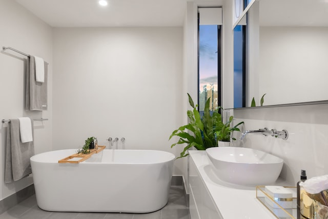 A newly refurnished bathroom with a white ceramic bathtub