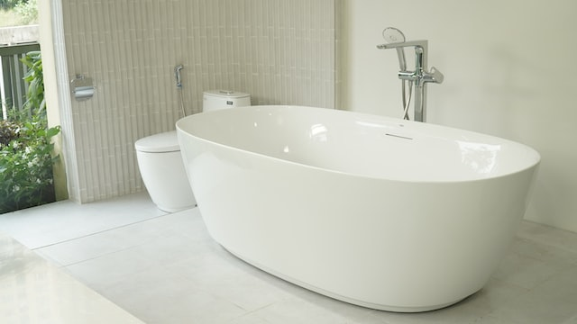 A reglazed white bathtub in a bathroom